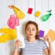 person in the middle of various cleaning supplies