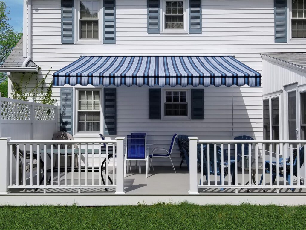 Blue White Striped Retractable Awning Over Patio