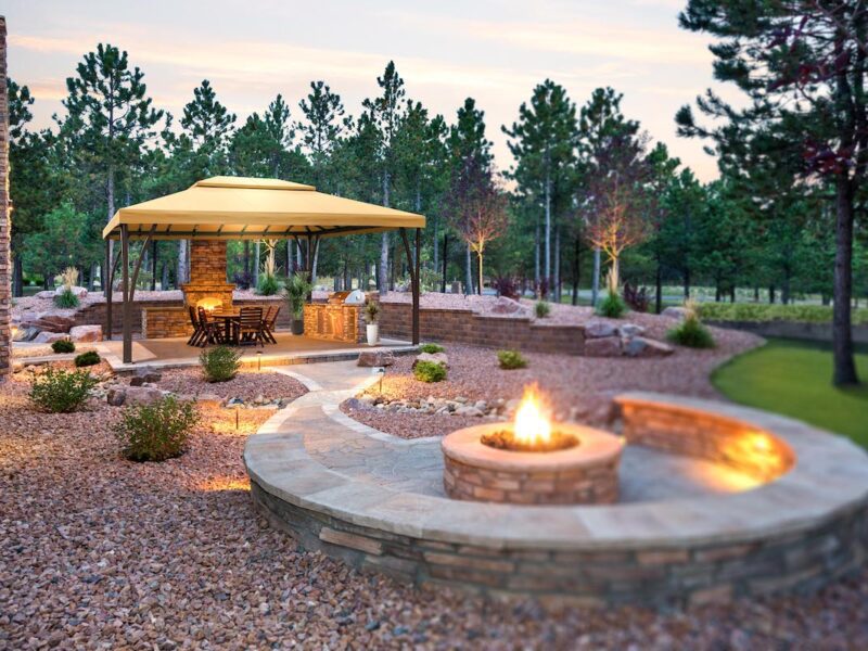 Open Air Cabana covers outdoor dining and kitchen in beautiful rock garden