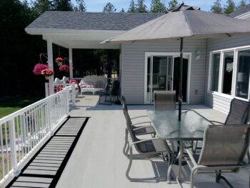 Attractive combination of Craft-Bilt aluminum decking in grey with Craft-Bilt aluminum railing in white.