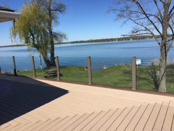 Enclose your deck in privacy with frosted glass. Glass panels also provide great wind protection.
