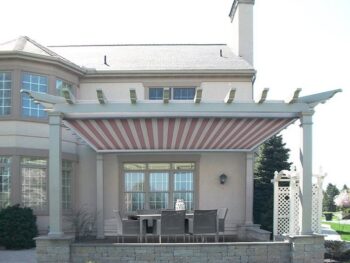 This red and white Tension Shade completes the outdoor seating area.