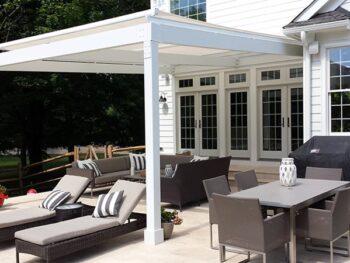 Tension shade structure unit installed over existing pergola structure.