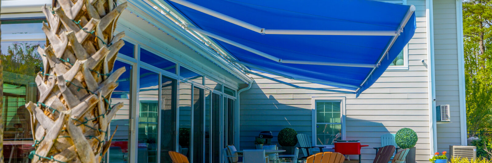 Retractable motorized awning extended side view Virginia Beach