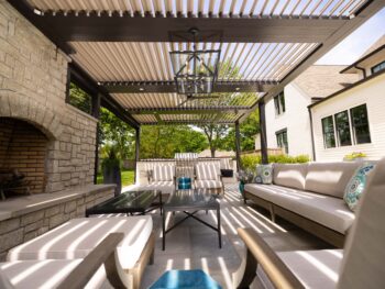 outdoor living space shaded by louvered roof pergola