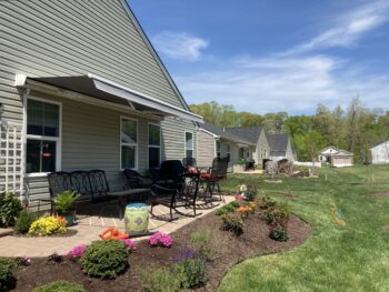 Motorized awning over patio furnitureA