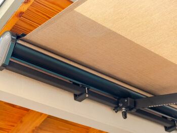 Motorized awning underside with cassette