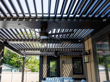 Black Pergola showing underside with ceiling fan