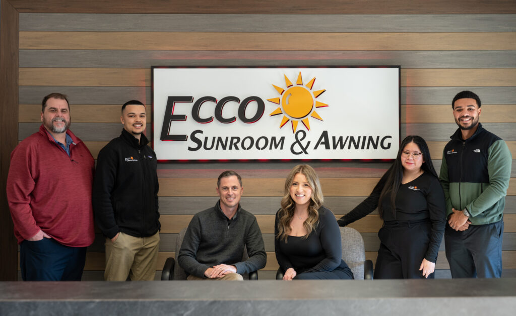 ECCO Sunroom & Awning Team Surrounding Showroom Sign